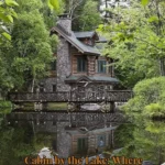 Scenic view of a serene cabin by the lake surrounded by nature.