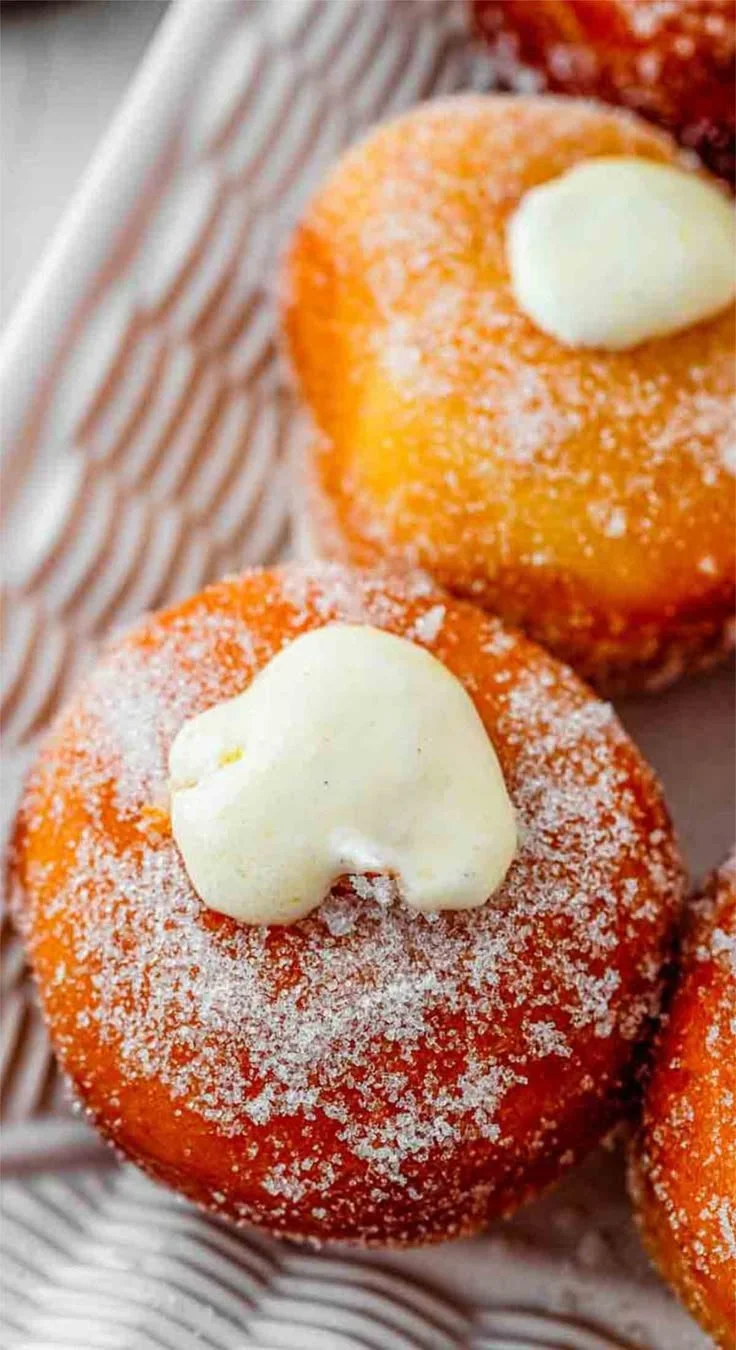 Variety of colorful doughnuts with different toppings and fillings