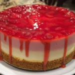 Strawberry and white chocolate mousse cake decorated with fresh strawberries