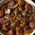 Delicious Salisbury steak meatballs topped with creamy mushroom gravy