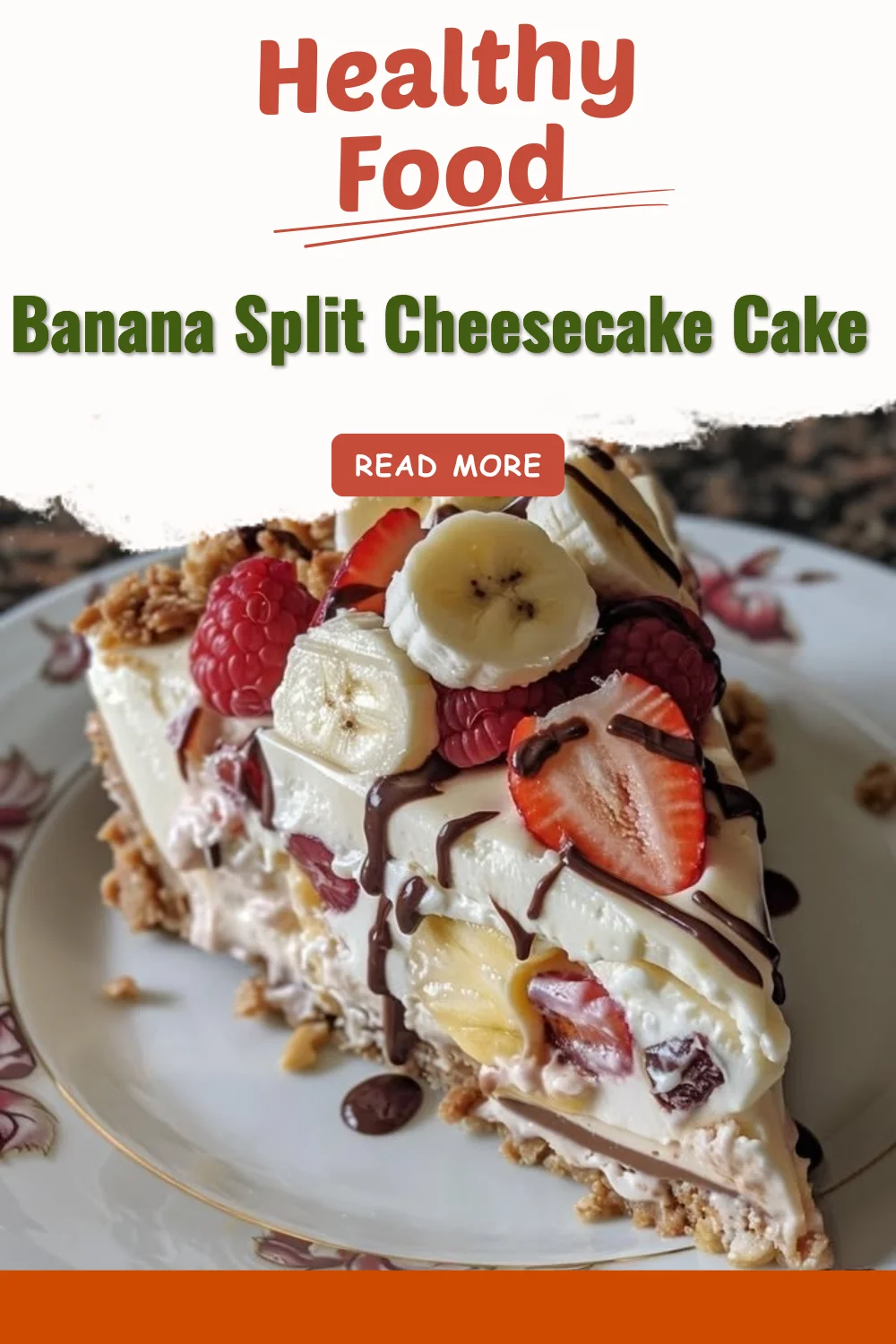 Slice of Banana Split Cheesecake Cake topped with cherries and whipped cream