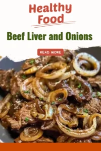 Juicy beef liver cooked with onions, served on a plate.