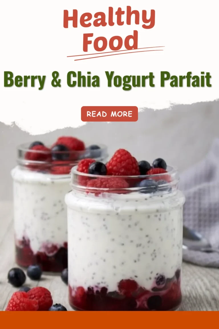 Berry & Chia Yogurt Parfait in a glass with fresh berries and chia seeds