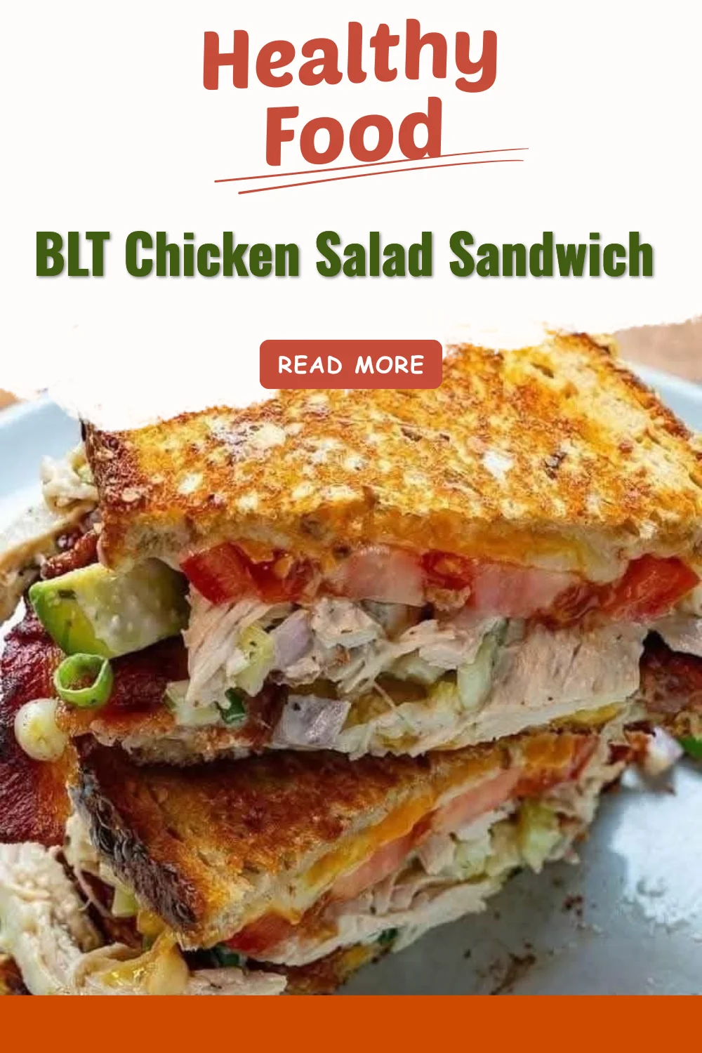 BLT Chicken Salad Sandwich with bacon, lettuce, tomatoes, and chicken in a toasted bun