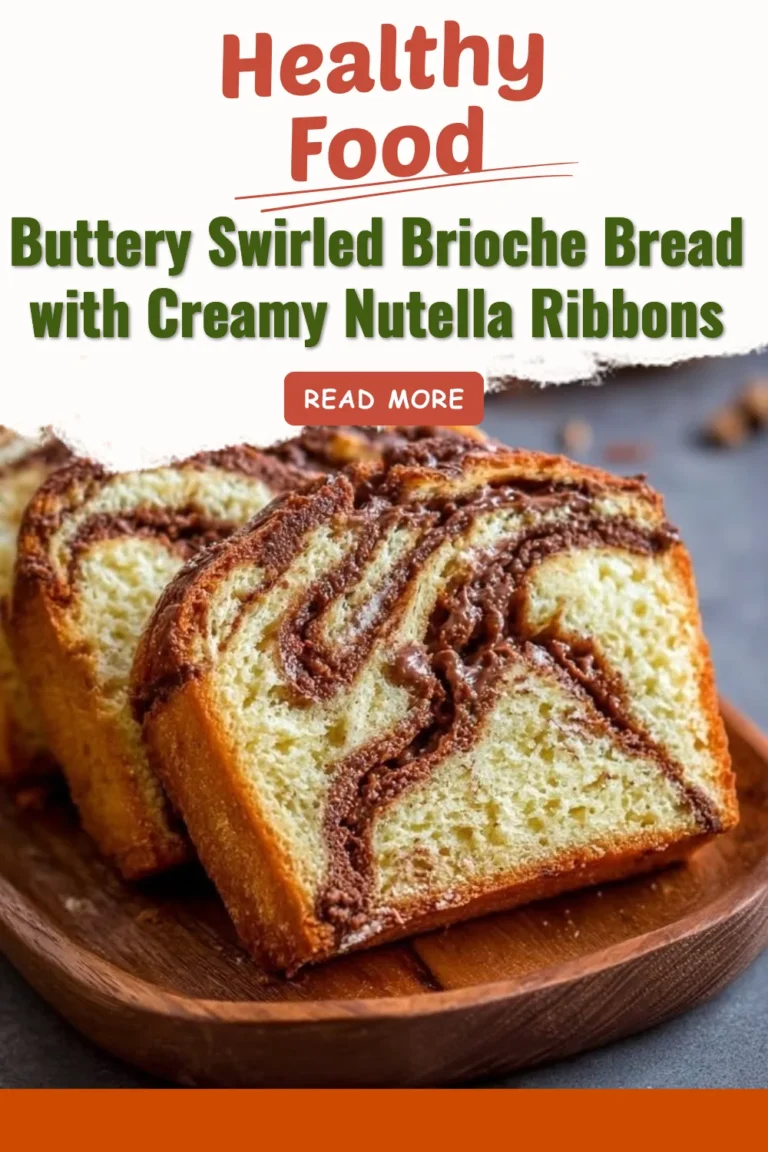 Buttery swirled brioche bread with Nutella ribbons on a wooden cutting board.