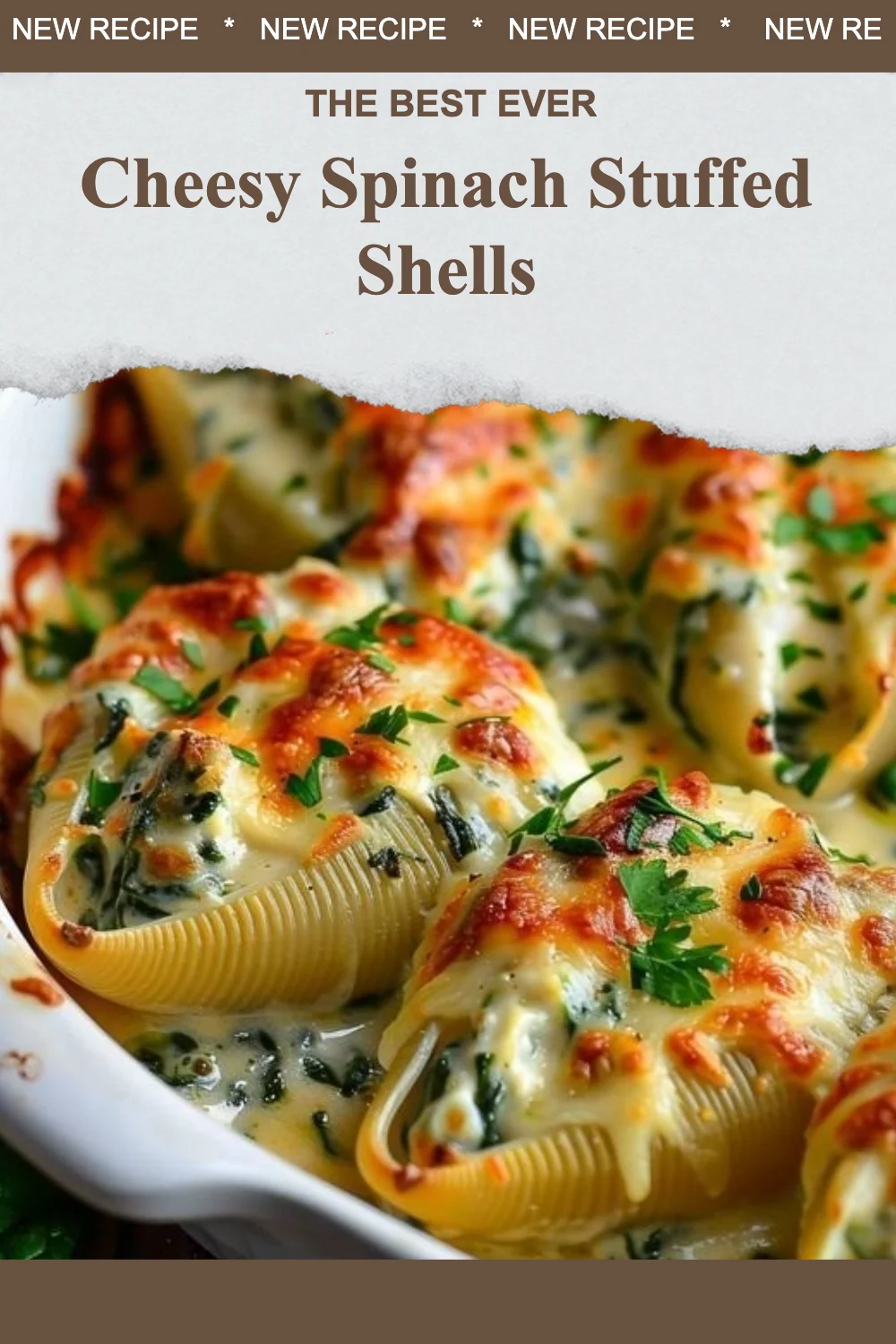 Cheesy spinach stuffed shells topped with marinara sauce and cheese