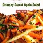 Crunchy carrot apple salad with fresh ingredients served in a bowl
