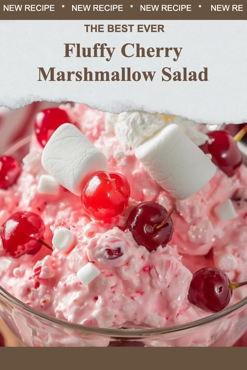 Delicious fluffy cherry marshmallow salad served in a bowl with cherries on top.