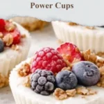 Delicious frozen yogurt granola power cups topped with fresh fruits and nuts.