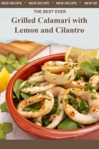 Plate of grilled calamari garnished with lemon and cilantro