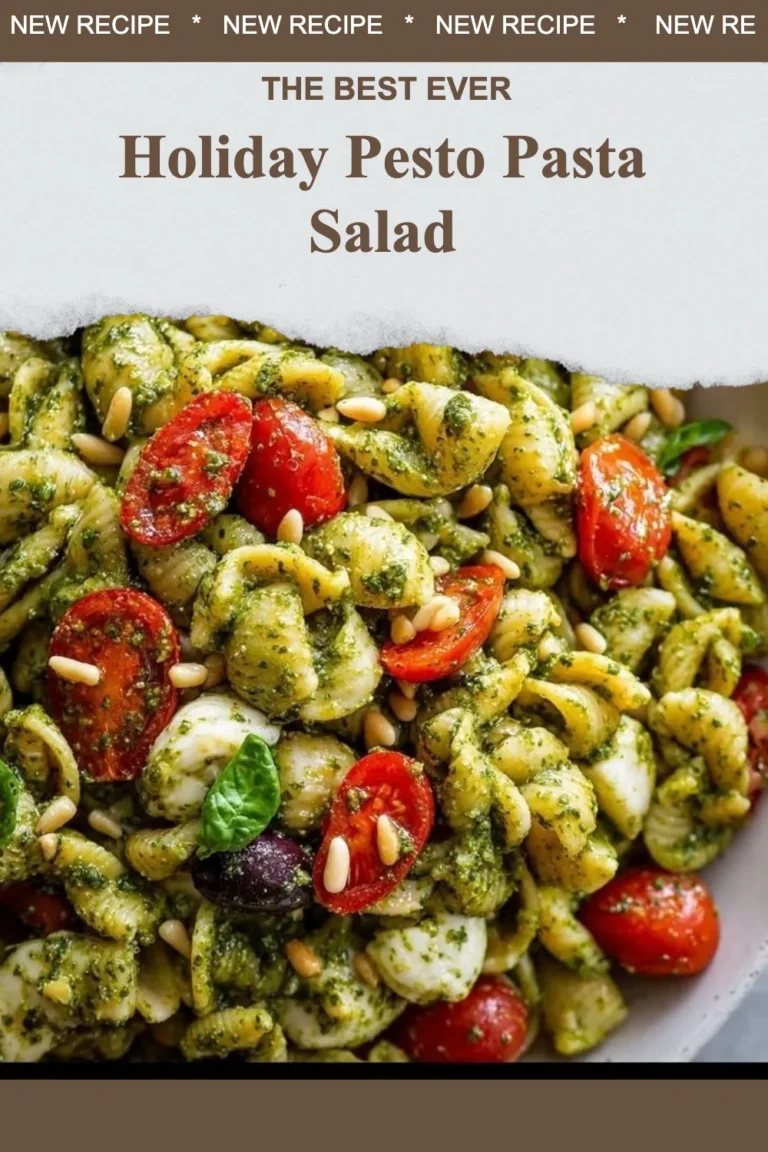 Bowl of colorful Holiday Pesto Pasta Salad with fresh vegetables and herbs