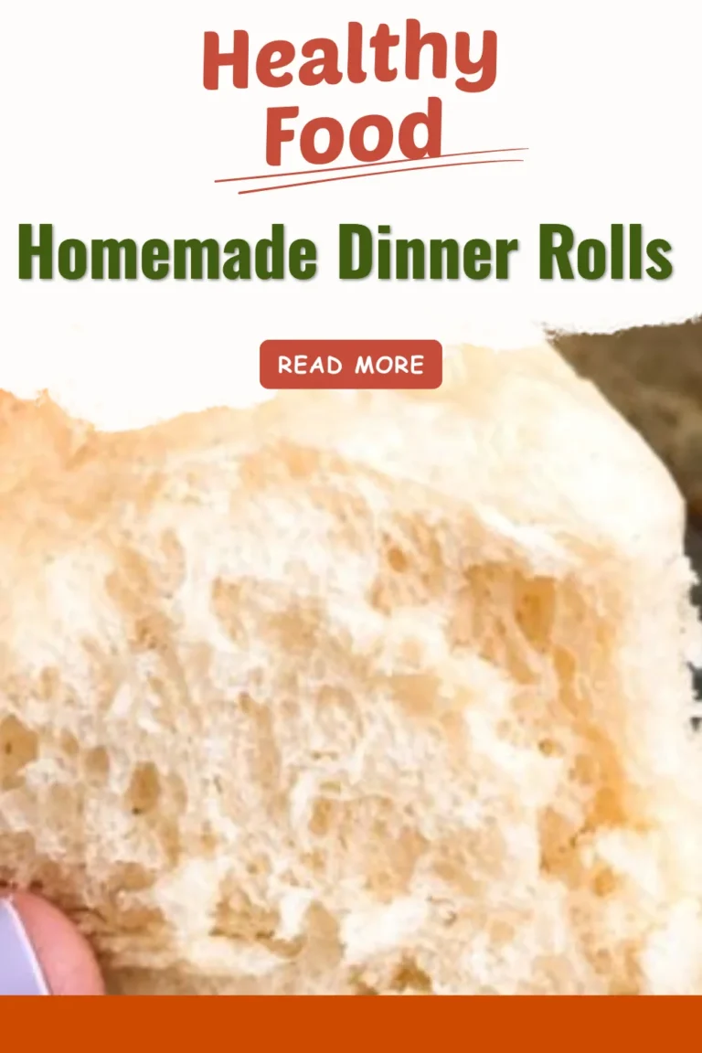 Freshly baked homemade dinner rolls on a wooden table
