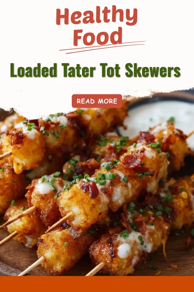 Loaded tater tot skewers topped with cheese, bacon, and green onions