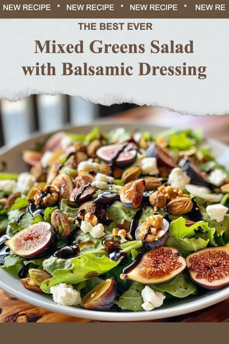 Mixed greens salad topped with balsamic dressing and colorful vegetables