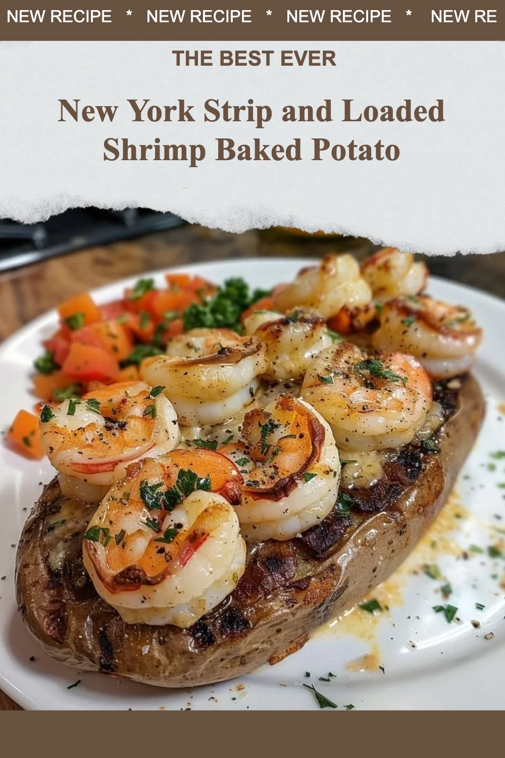 New York Strip steak with a loaded shrimp baked potato on a plate