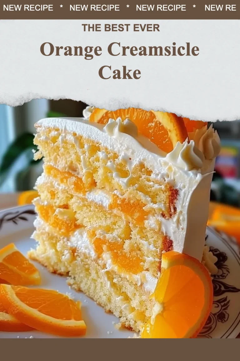 Delicious Orange Creamsicle Cake topped with orange frosting and cream