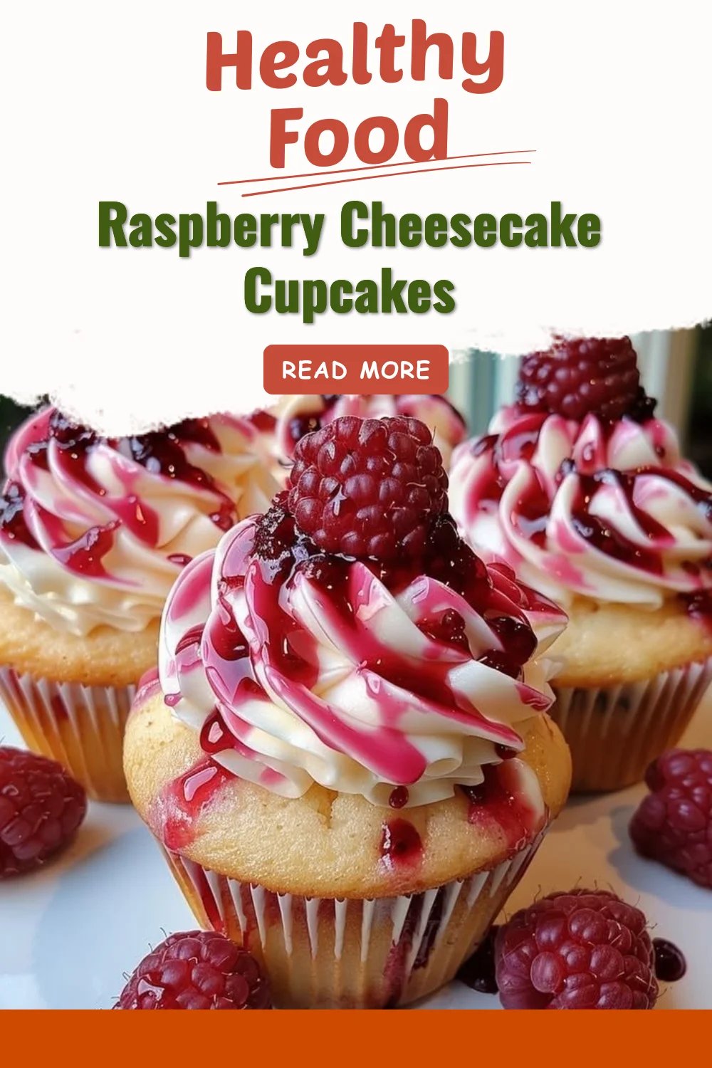 Raspberry cheesecake cupcakes topped with fresh raspberries and whipped cream