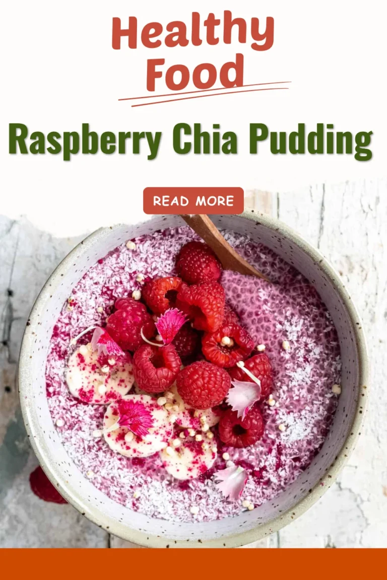 Bowl of raspberry chia pudding topped with fresh raspberries and mint leaves