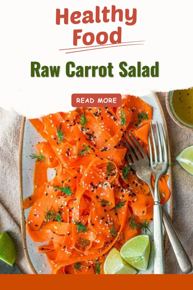 Fresh raw carrot salad with herbs and dressing on a plate.