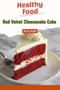 Slice of Red Velvet Cheesecake Cake topped with cream cheese frosting