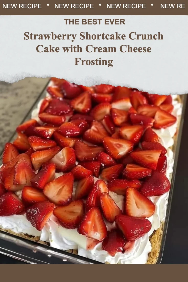 Strawberry Shortcake Crunch Cake with Cream Cheese Frosting on a white plate.