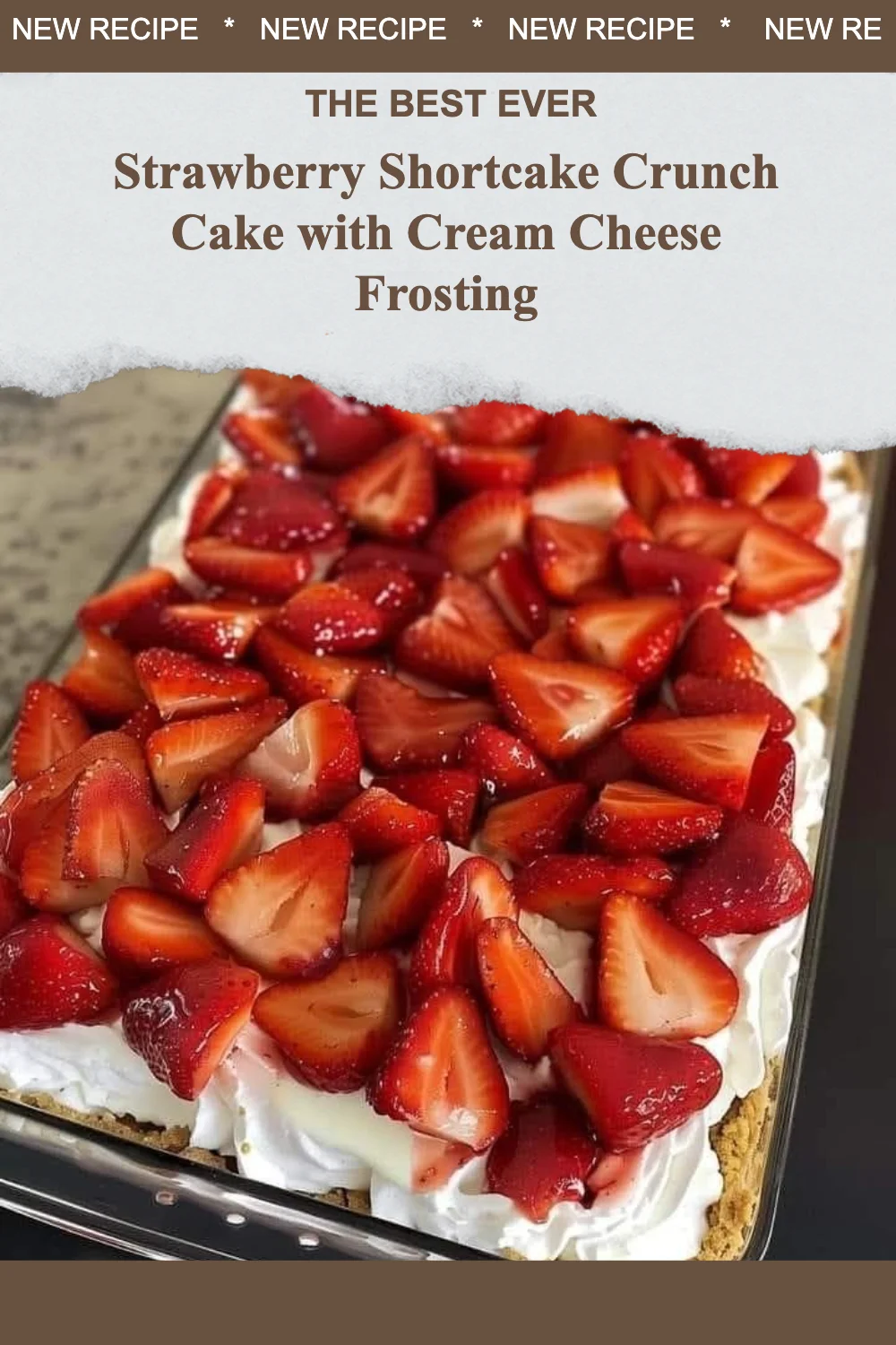 Strawberry Shortcake Crunch Cake with Cream Cheese Frosting on a white plate.
