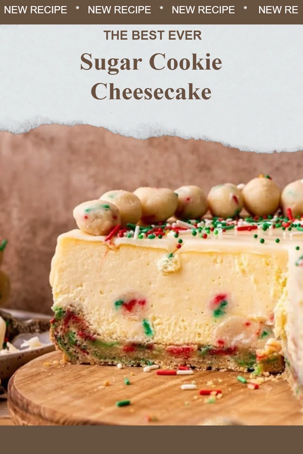 Delicious sugar cookie cheesecake topped with sprinkles and whipped cream