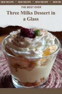 Delicious Three Milks Dessert in a glass topped with fresh fruit.