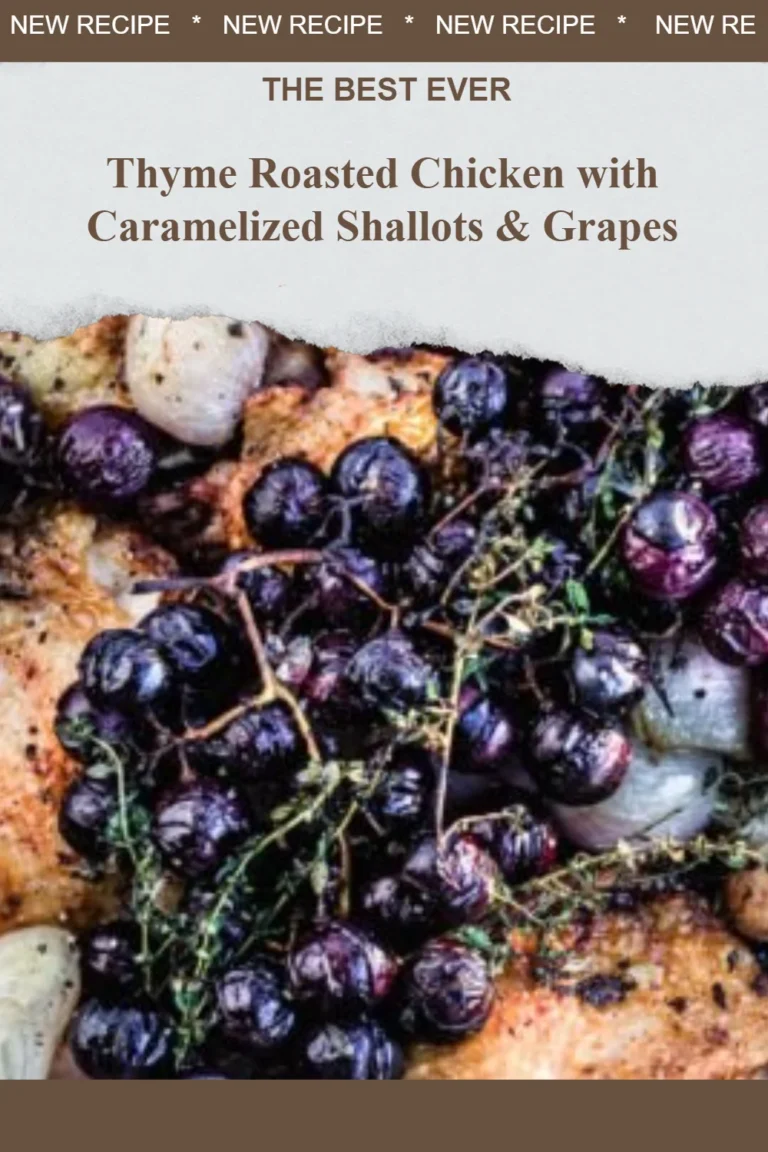 Thyme roasted chicken with caramelized shallots and grapes served on a plate