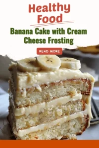Delicious banana cake topped with cream cheese frosting on a plate