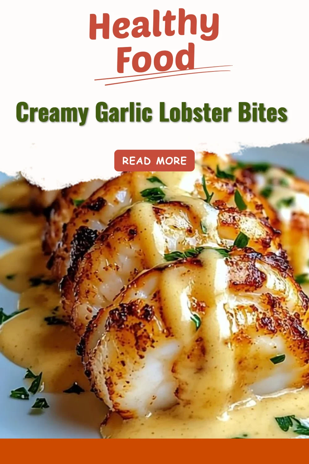 Creamy garlic lobster bites served in a bowl, drizzled with sauce.