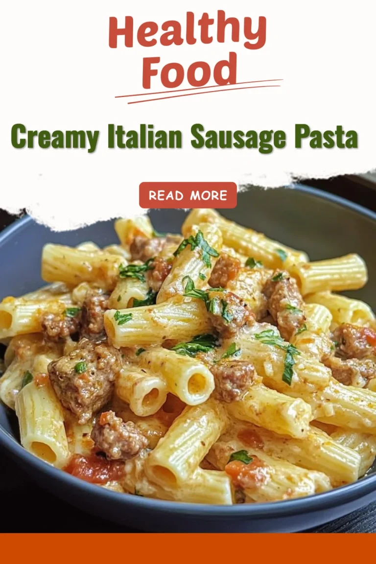 Creamy Italian sausage pasta served in a bowl with herbs and cheese.