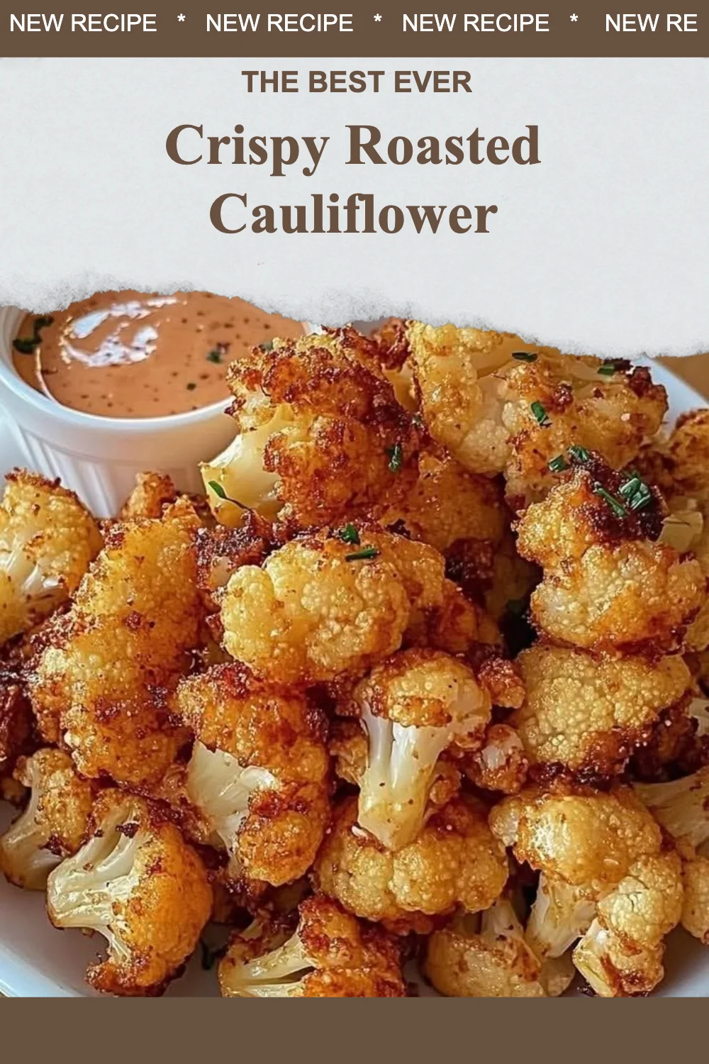 A plate of crispy roasted cauliflower garnished with herbs and spices