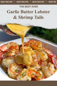 Delicious garlic butter lobster and shrimp tails on a white plate.