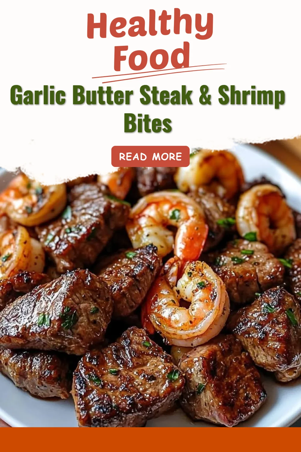 Delicious Garlic Butter Steak & Shrimp Bites served with fresh herbs