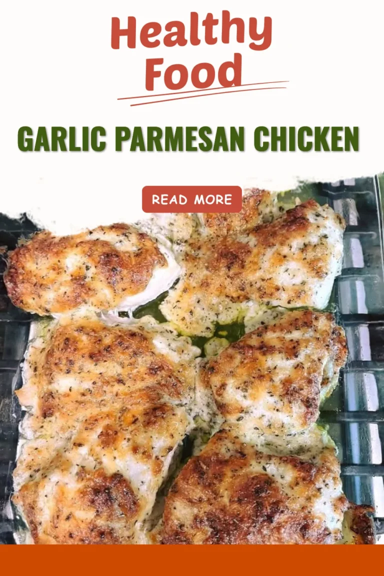 Juicy garlic parmesan chicken garnished with herbs and served on a plate