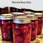Homemade canned strawberries in jars for winter preservation