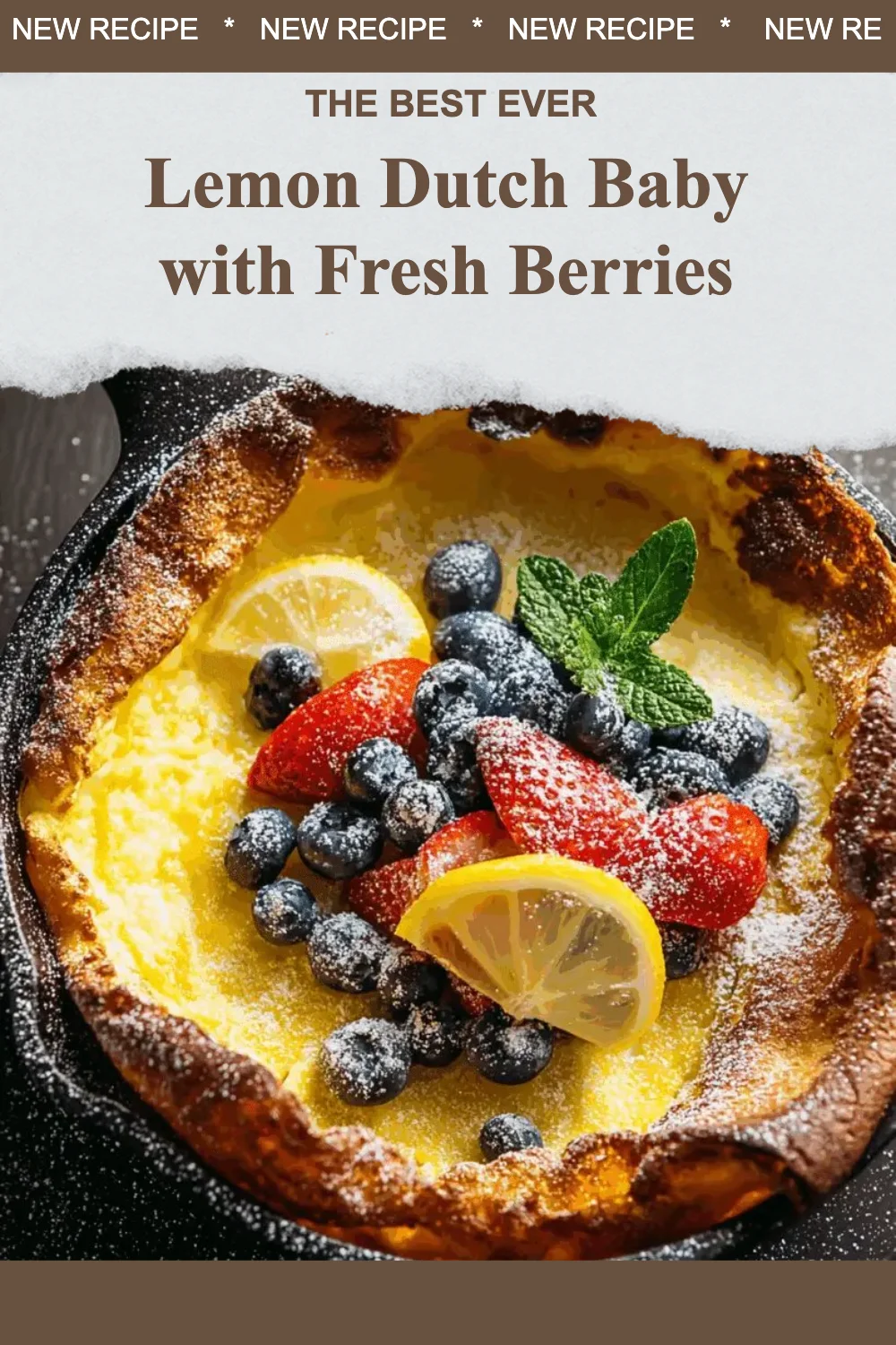 Lemon Dutch Baby topped with fresh berries on a plate