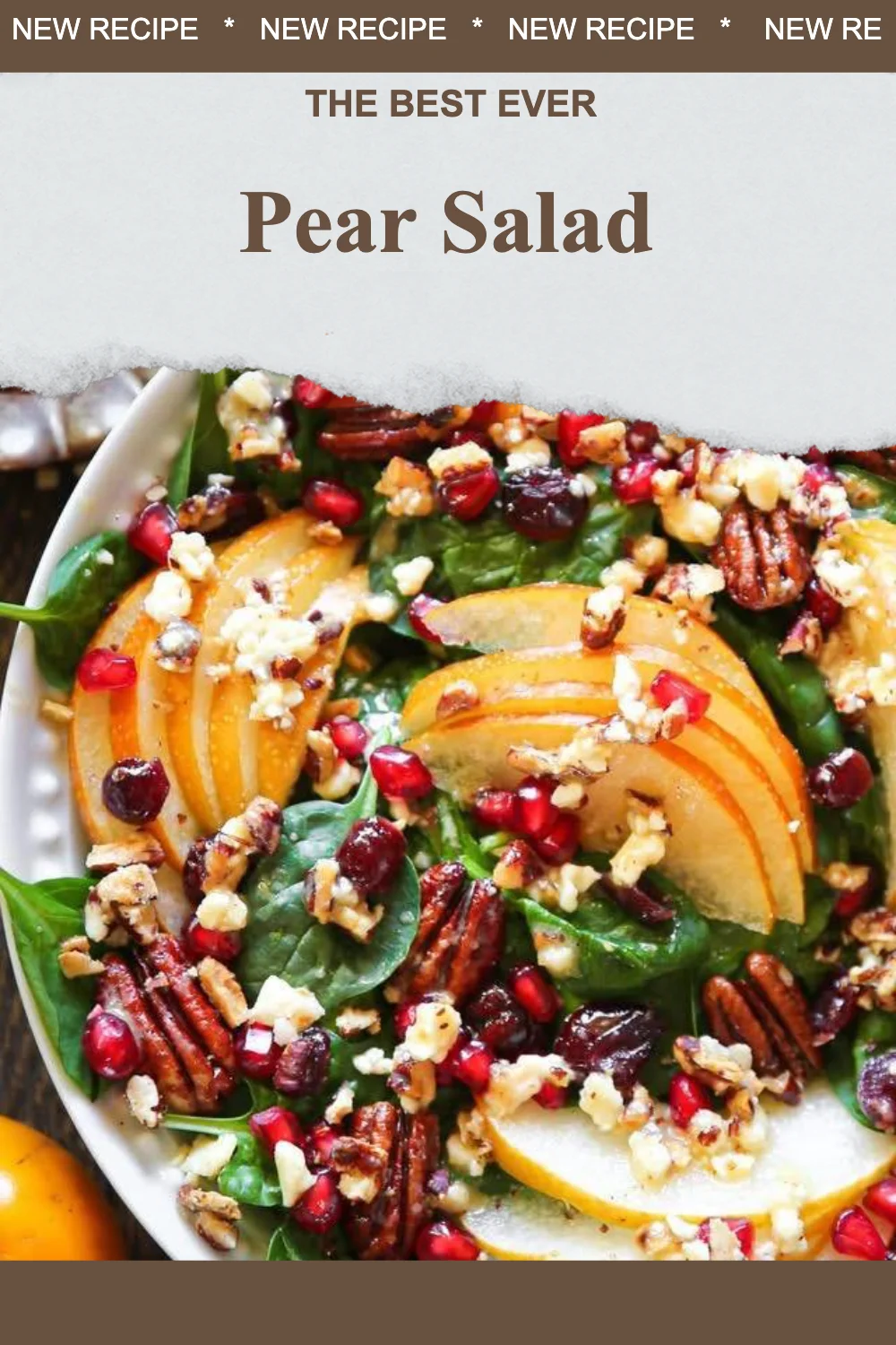 Delicious bowl of pear salad with greens and nuts