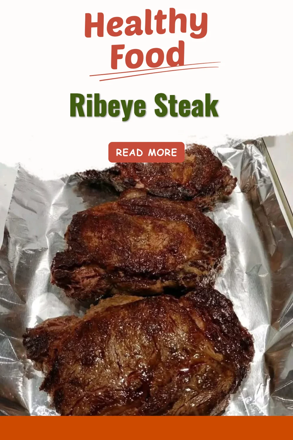 Perfectly grilled ribeye steak on a plate, garnished with herbs.