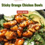 Delicious sticky orange chicken bowls garnished with green onions and sesame seeds