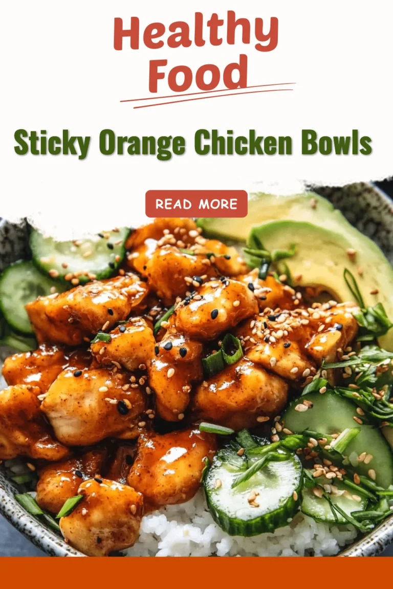 Delicious sticky orange chicken bowls garnished with green onions and sesame seeds