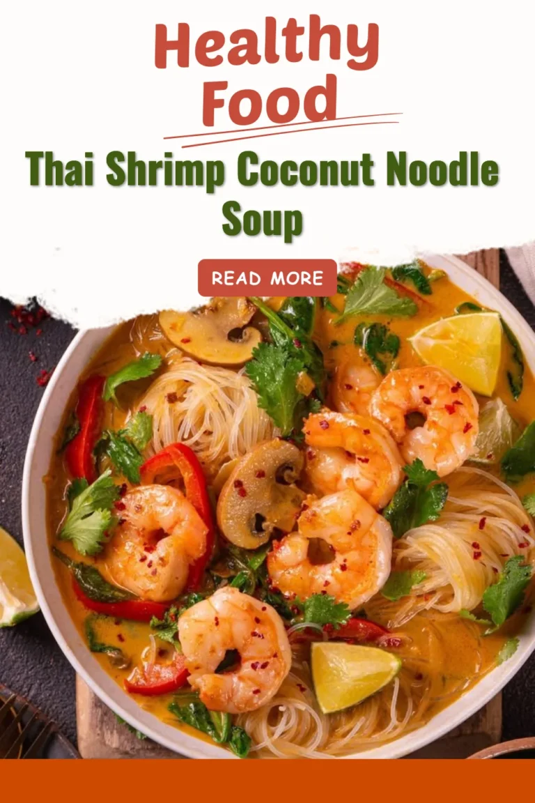 Bowl of Thai shrimp coconut noodle soup with shrimp and fresh herbs.