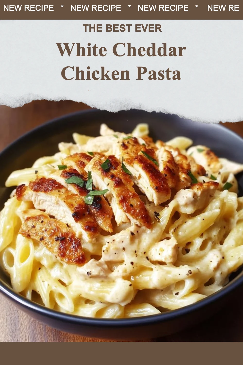 Creamy white cheddar chicken pasta served in a bowl with garnish