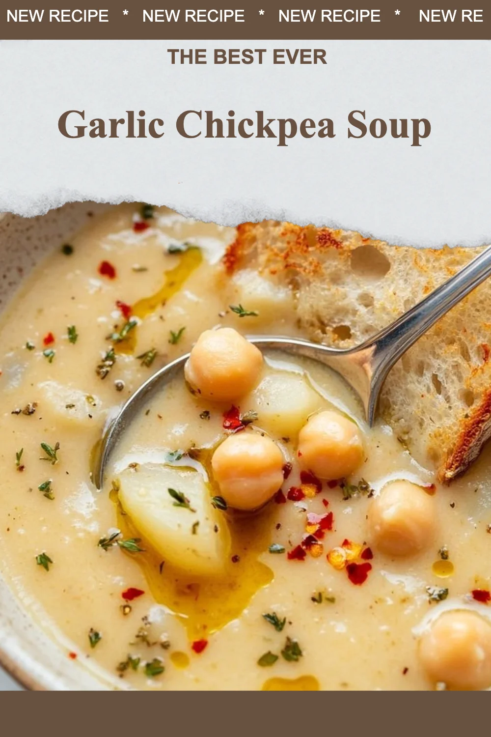 Bowl of Garlic Chickpea Soup garnished with herbs and served with bread.