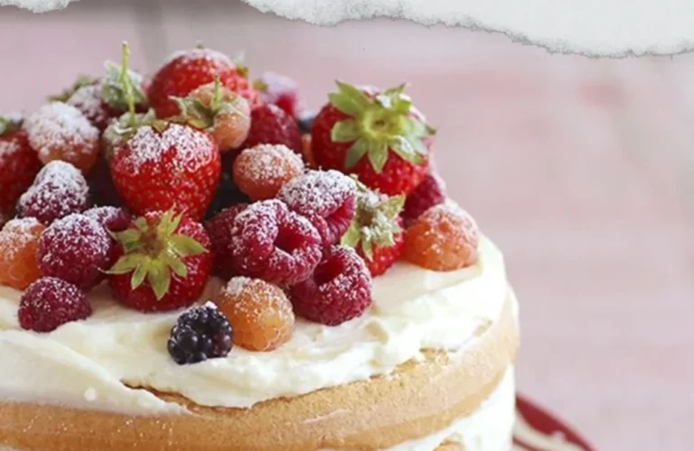 Naked cake topped with fresh red fruits for a delightful dessert