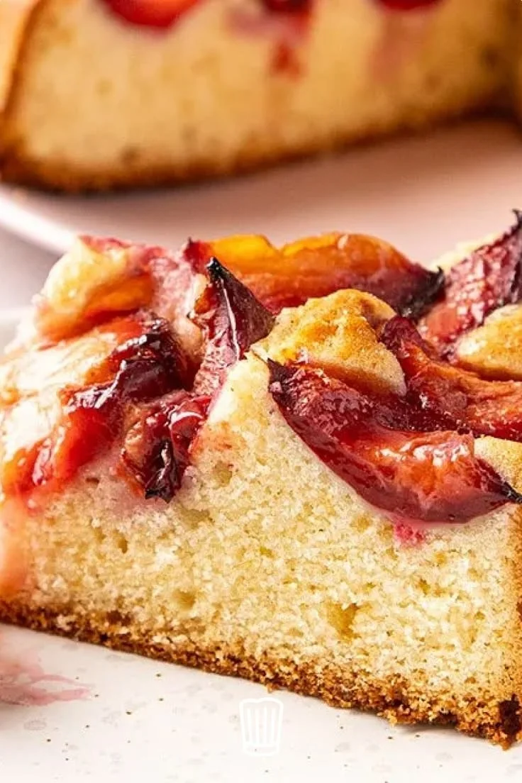 Delicious slice of homemade plum cake served on a rustic plate