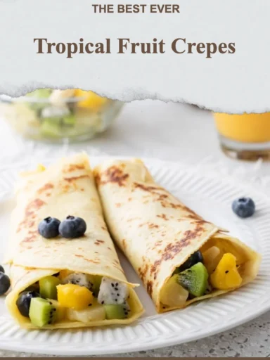 Tropical fruit crepes filled with fresh fruits and served on a plate