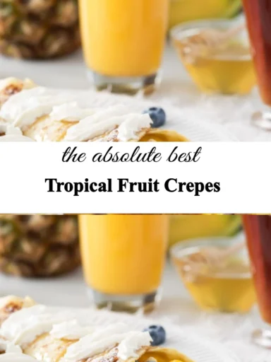 Delicious tropical fruit crepes topped with fresh fruit and a drizzle of sauce.